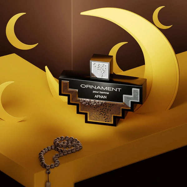 Perfume bottle labeled 'Ornament' by Afnan on a decorative crescent moon and star background.