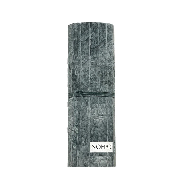 Marble-textured cylindrical product with 'NOMAD' branding on a white background