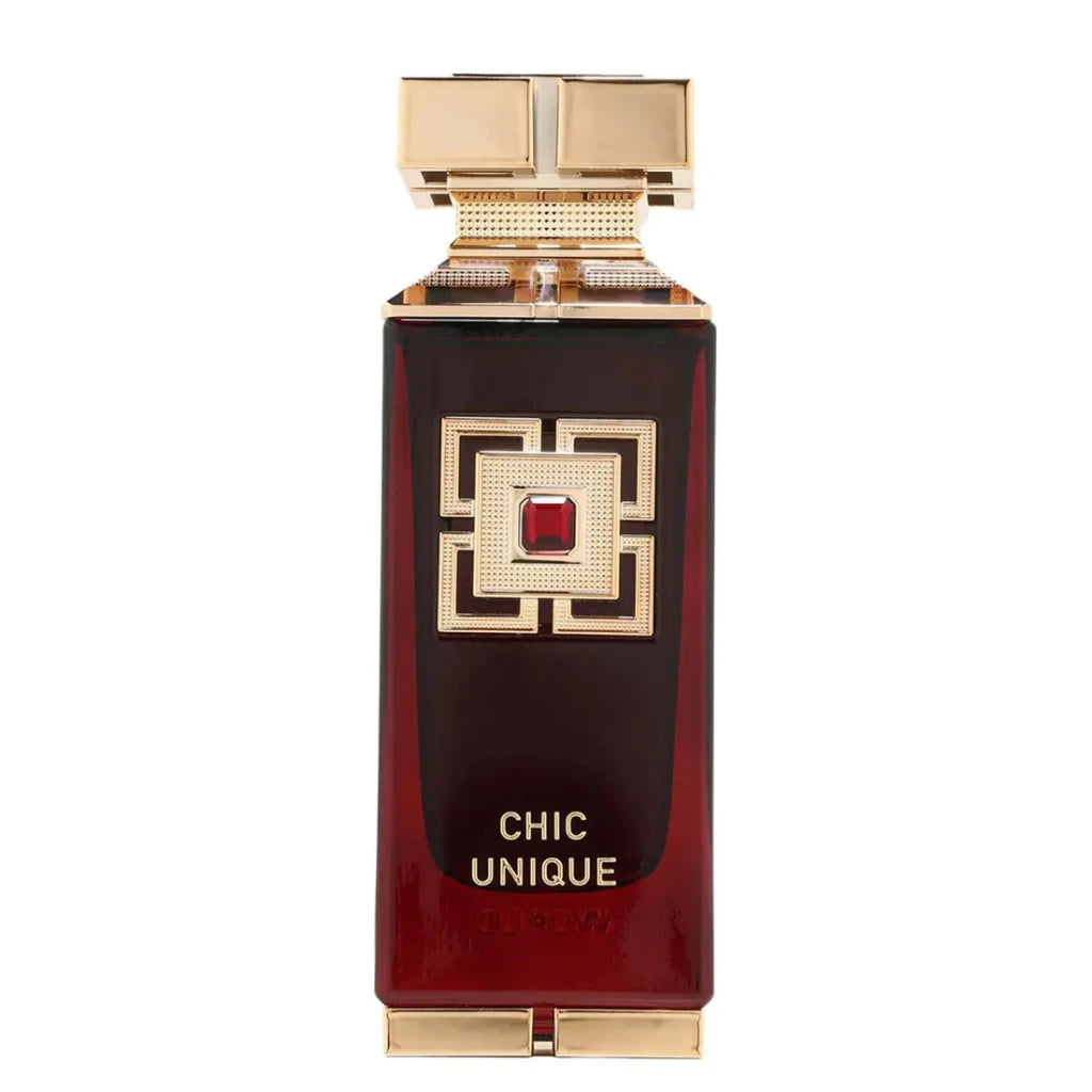 Perfume bottle with gold cap and red gem on a white background