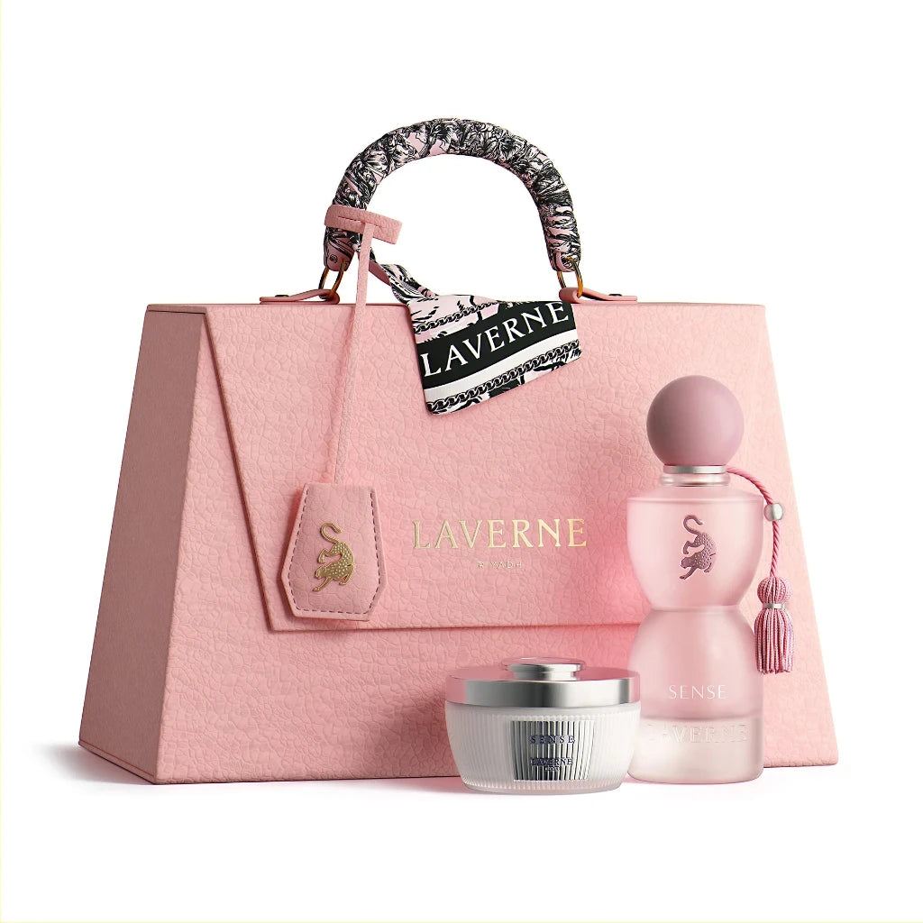 Pink handbag with 'Laverne' branding, accompanied by a pink perfume bottle and silver container on a white background.