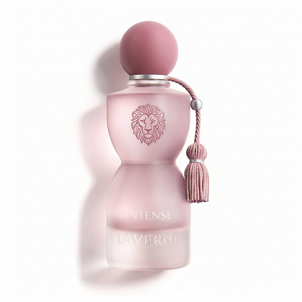 Pink perfume bottle with a tassel on a white background