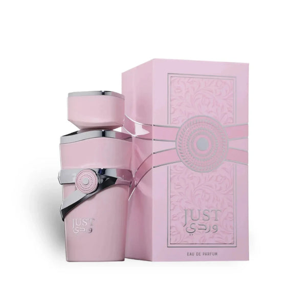 Pink perfume bottle and box with a bow on a white background