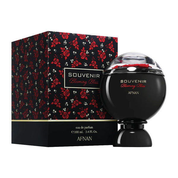 Blooming Bliss perfume bottle with red accents and matching box featuring floral design on a white background
