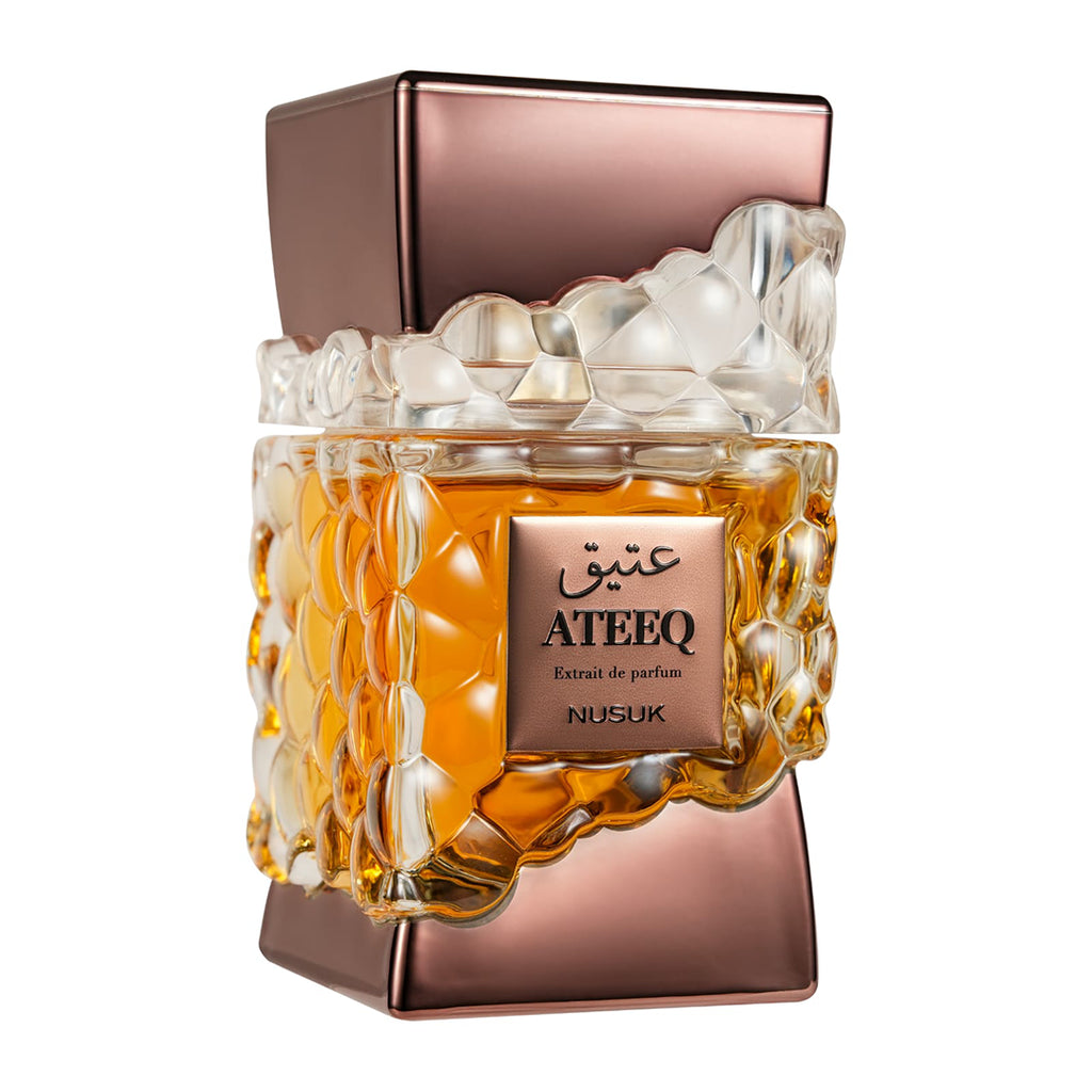 Aateeq Nusuk perfume bottle with a textured design on a white background