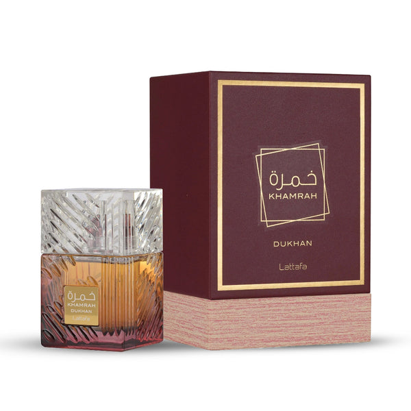 Khamrah Dukhan perfume bottle and packaging on a white background